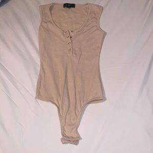 Cream bodysuit with snap bottom